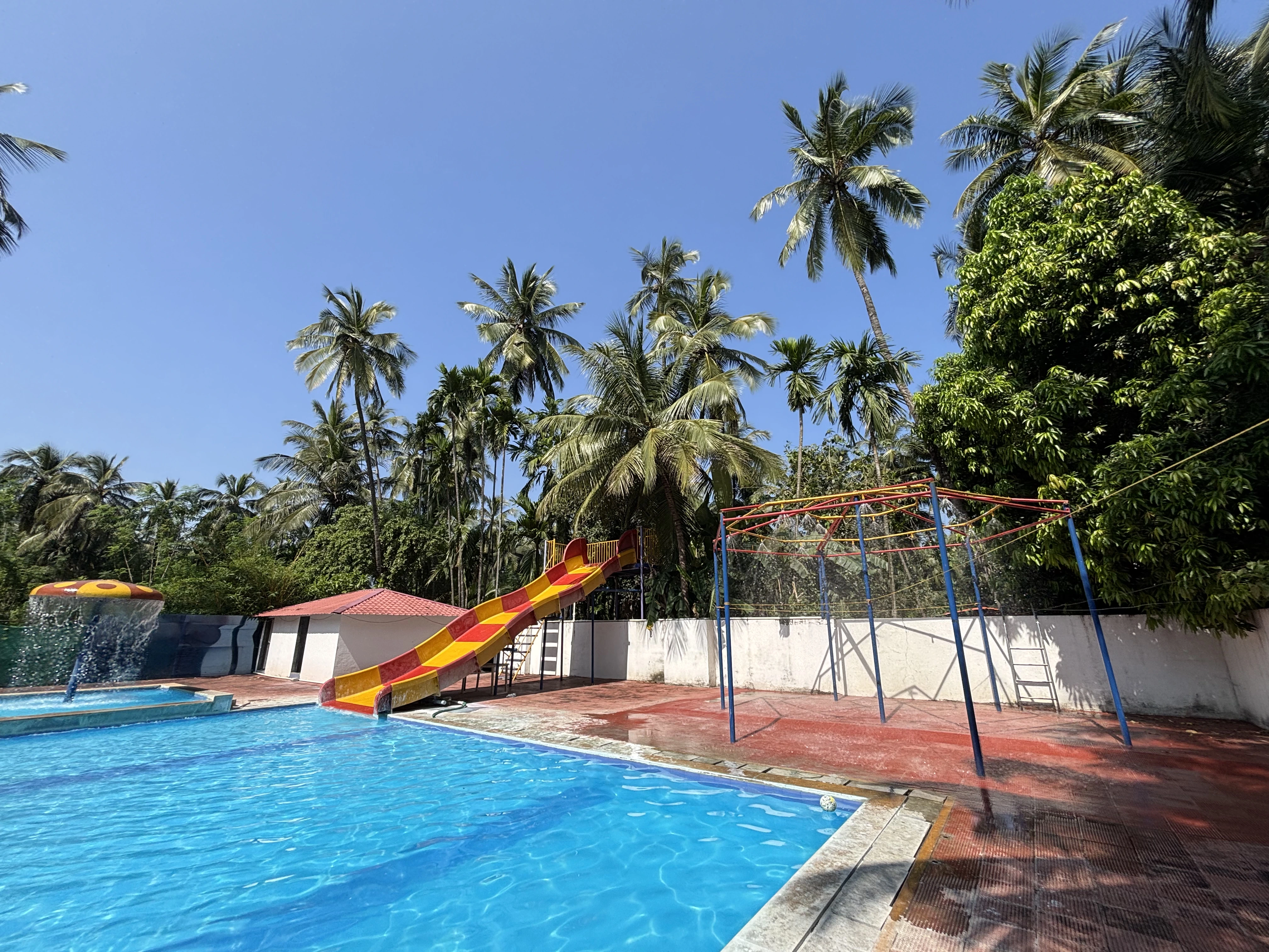 Beautiful swimming pool at Raj Resort in Kelva Beach, Palghar